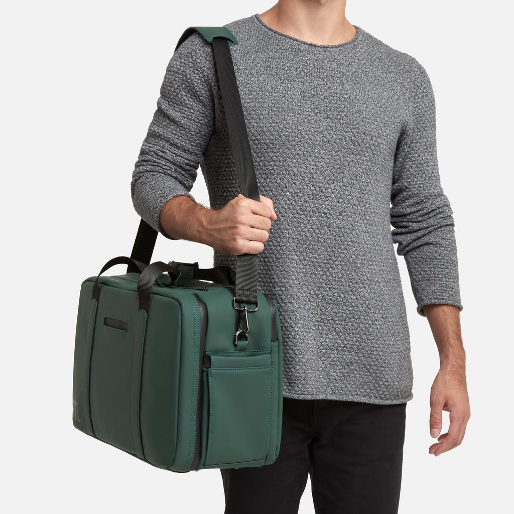 Men's gym duffel in green with adjustable shoulder strap and side pockets for stylish and functional daily use. Abbot Green,Kenmare Black,Essex Blue, Stone Grey