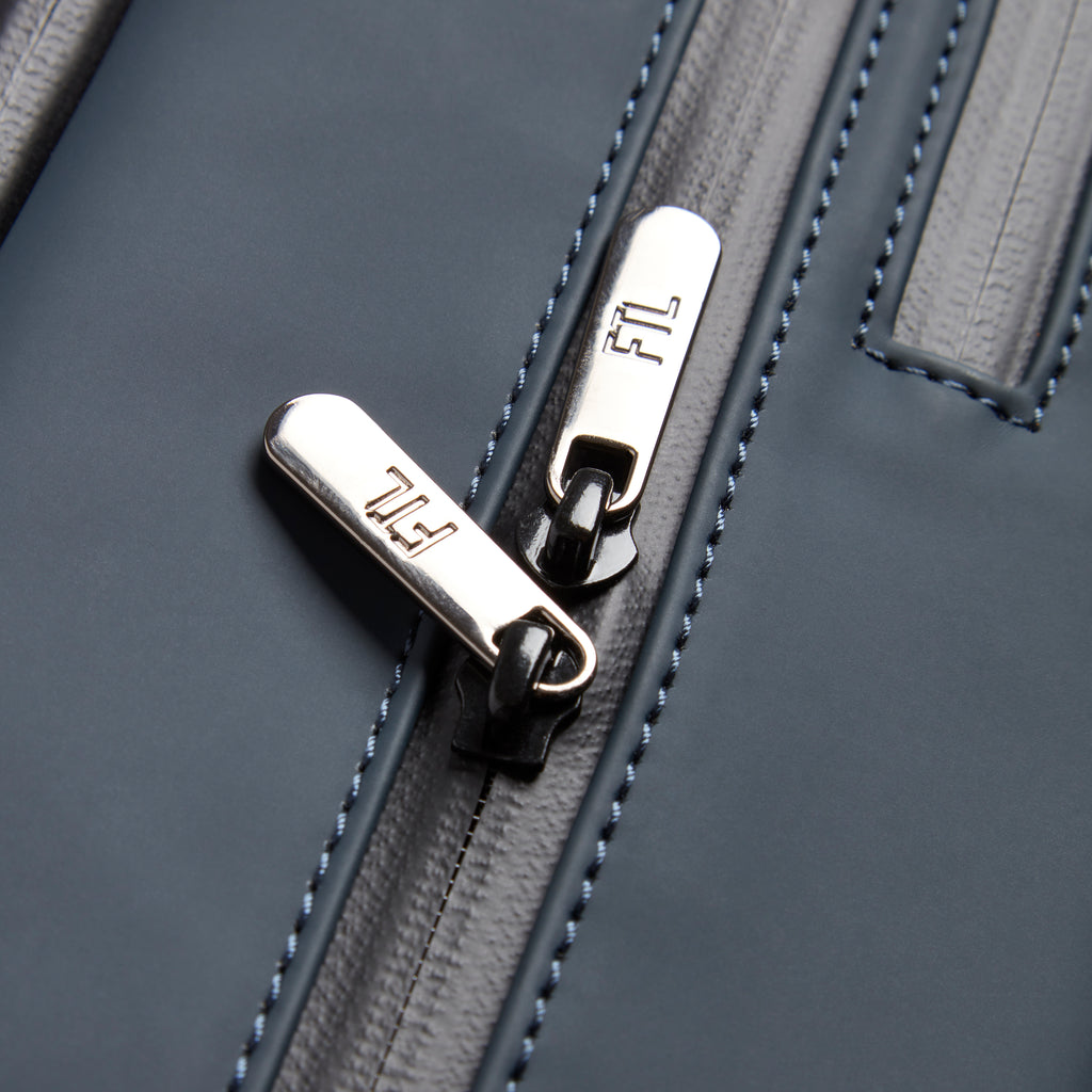 Gym bag for office workers featuring high-quality FTL-branded zippers and durable stitched detailing for professional daily use.