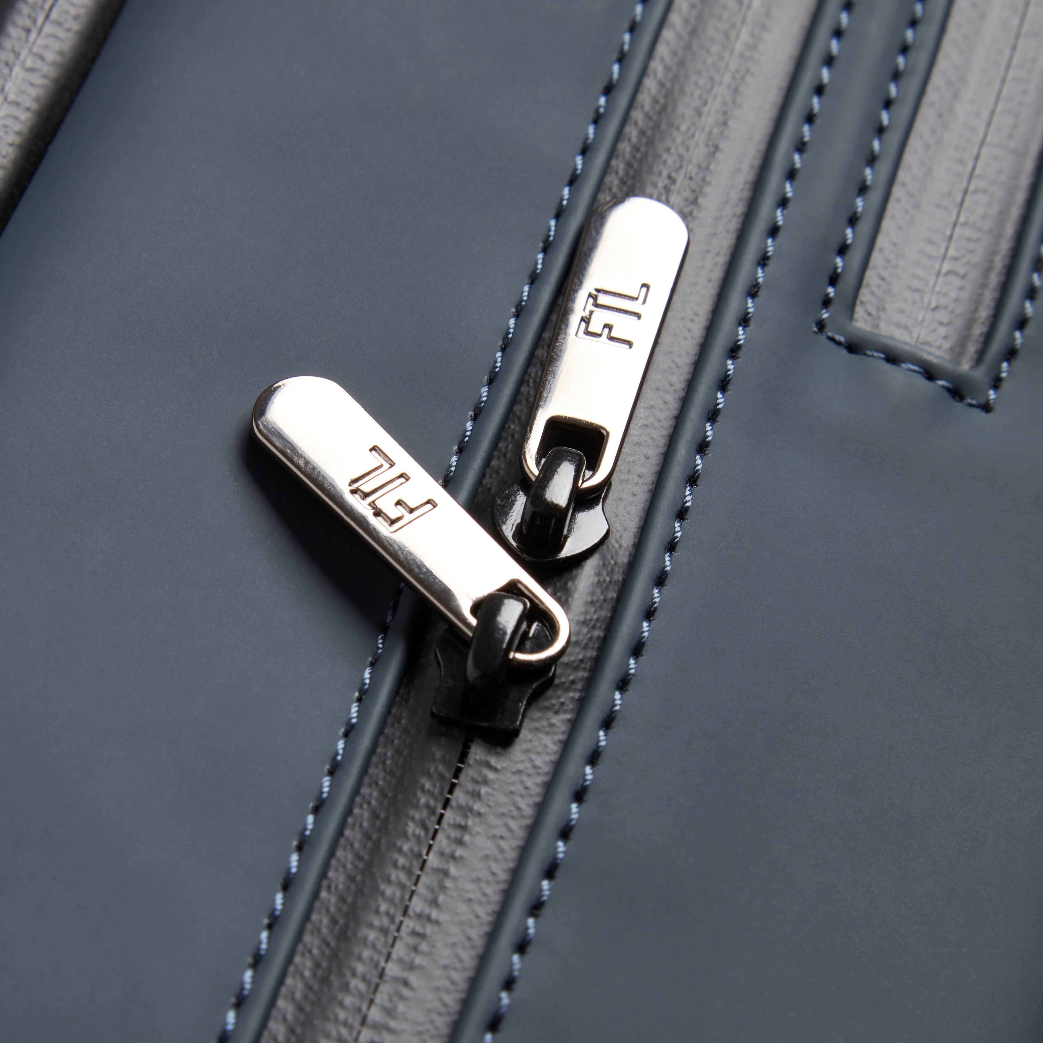 Gym bag for office workers featuring high-quality FTL-branded zippers and durable stitched detailing for professional daily use.