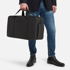 Gym and office bag in black with structured silhouette and side pocket, ideal for business attire and workout gear.