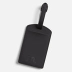 Black PU leather FTL luggage tag with embossed logo and buckle strap.