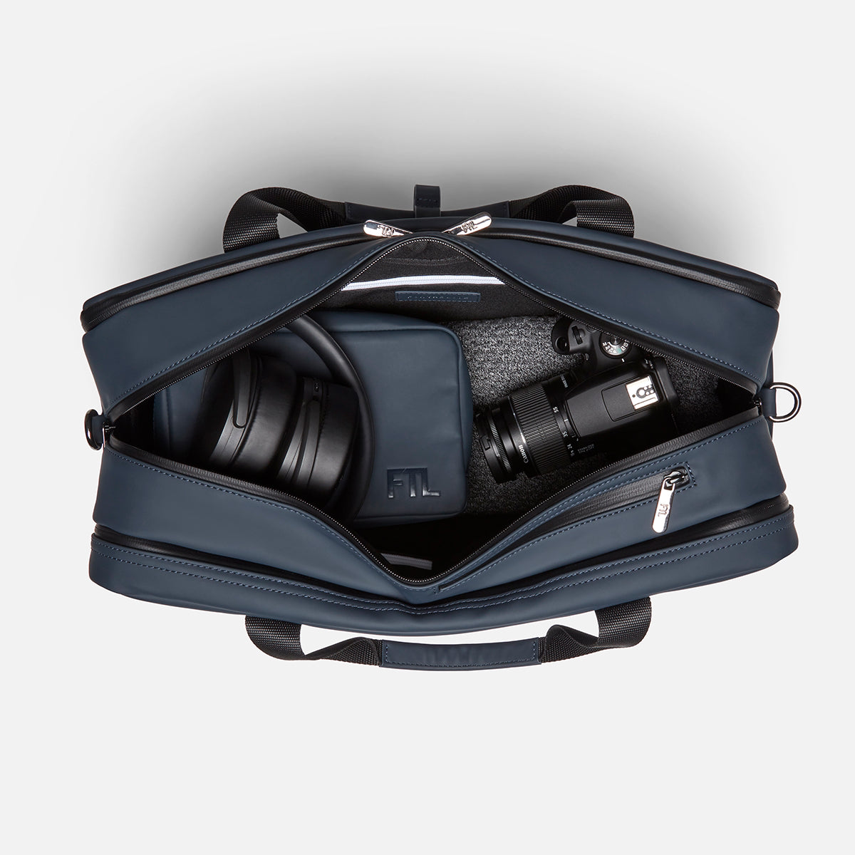 The best gym and work bag featuring organized compartments for headphones, camera gear, and accessories in a sleek zip-top design. Abbot Green,Kenmare Black,Essex Blue, Stone Grey