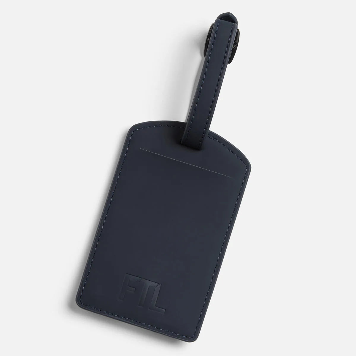 Navy blue PU leather FTL luggage tag with embossed logo and buckle strap.