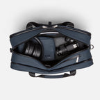 The best gym and work bag featuring organized compartments for headphones, camera gear, and accessories in a sleek zip-top design. Abbot Green,Kenmare Black,Essex Blue, Stone Grey